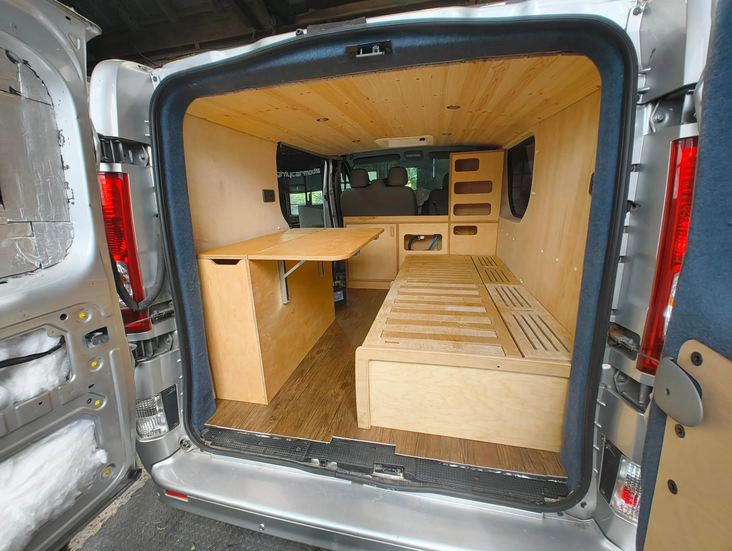 Looking into the Vivaro through the open rear doors, with the ply bed slats and units in place.